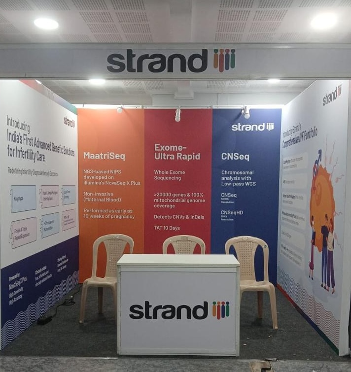 Strand Life Sciences exhibition branding and graphics with branded product panels and counter